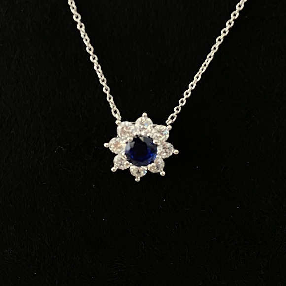 Harry Winston Jewelry - Harry Winston Flower Pendant Necklace With A Blue Gemstone At The Center